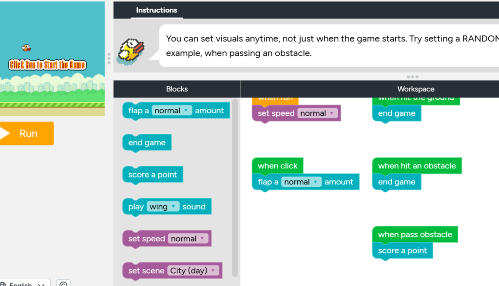 photo of coding a flappy bird game using block-coding software in a gamified way.
